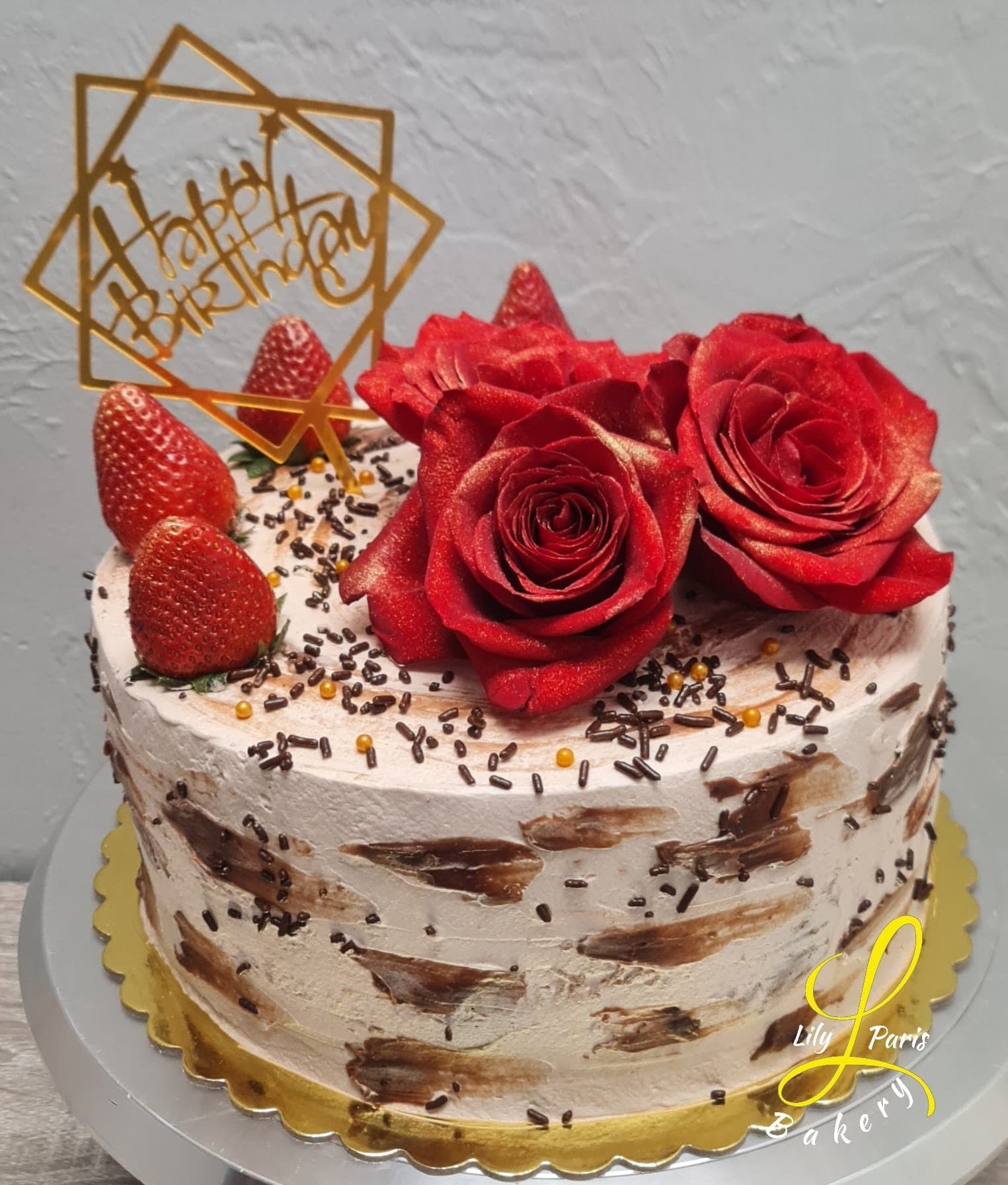 Birthday cake with red roses and strawberries