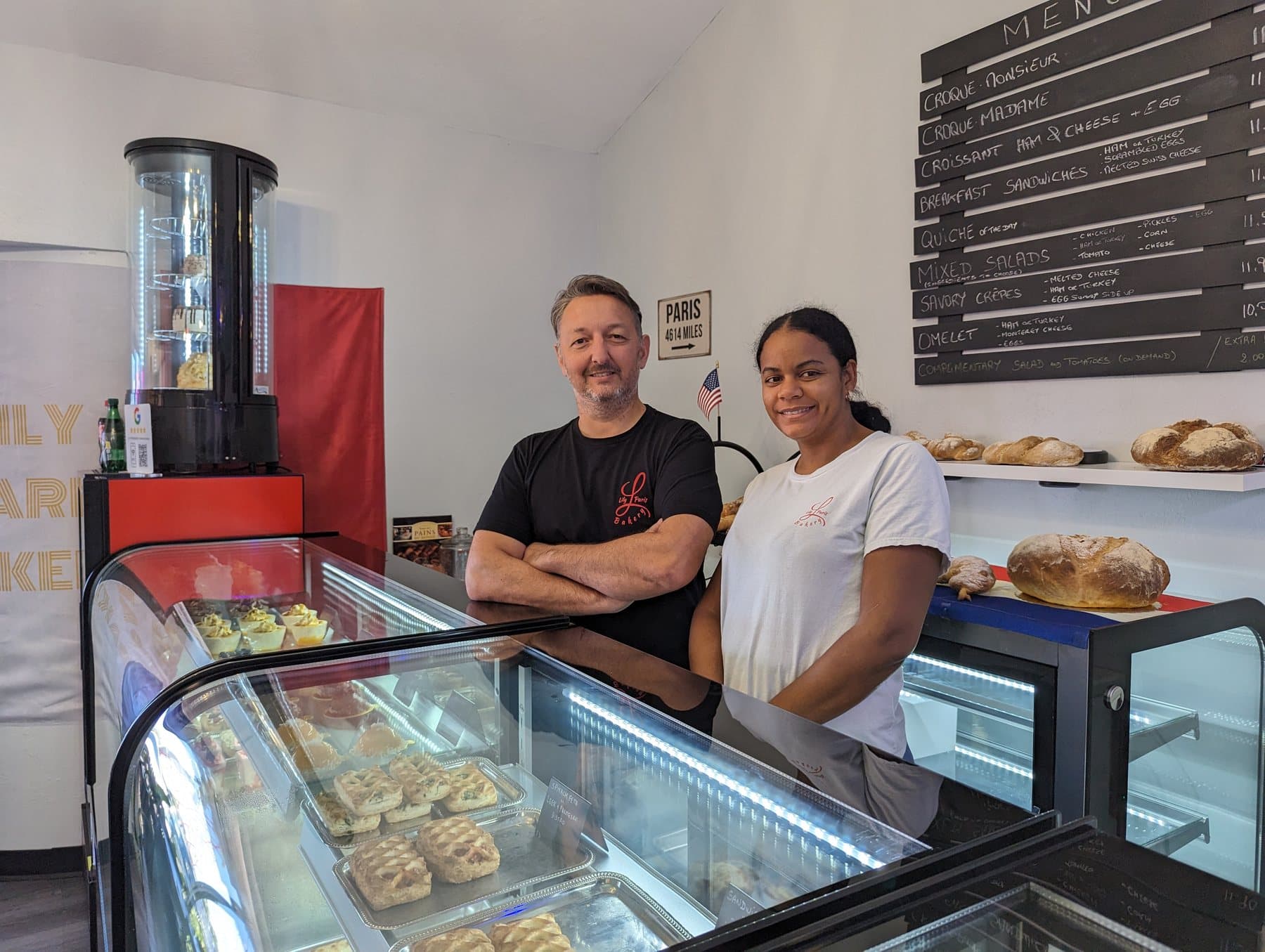 The owners of Lily Paris Bakery behind the counter